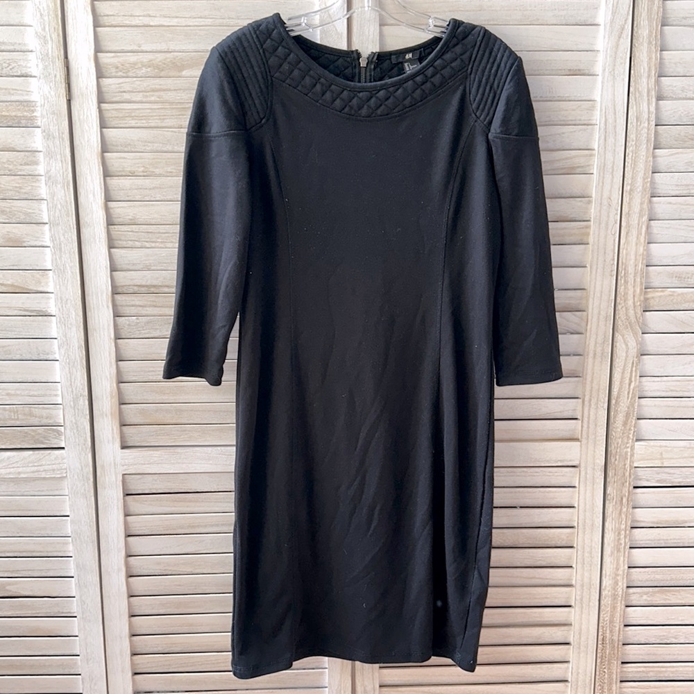 Black 3/4 sleeve zip up dress.